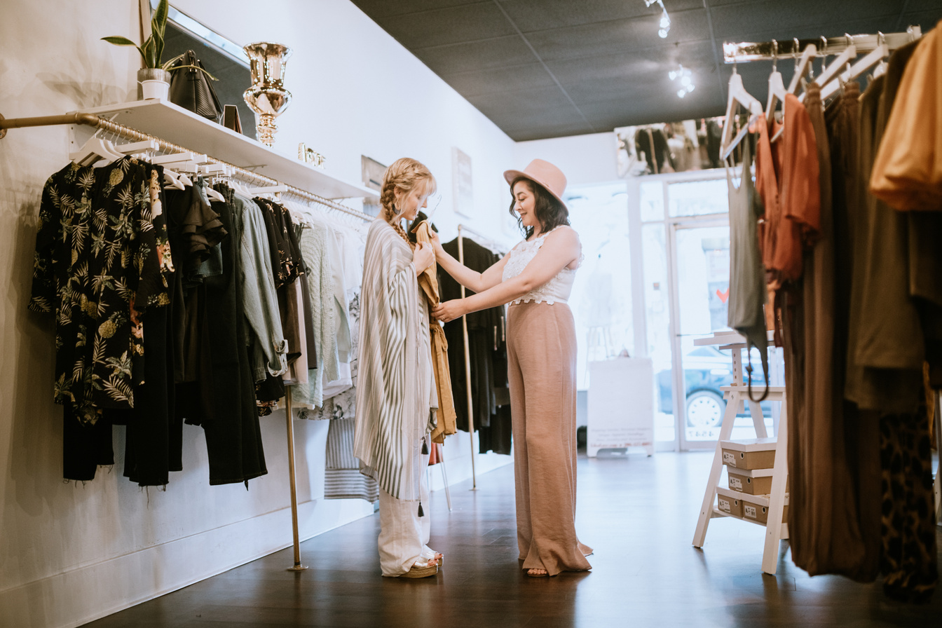 Latina Boutique Store Owner Assisting Customer